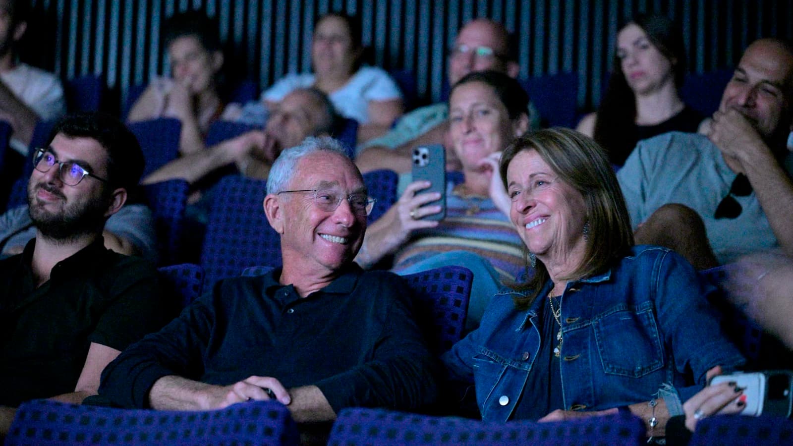 Joey and Carol Low seated in the audience during a screening at OctoberDoc, Tel Aviv Cinematheque.