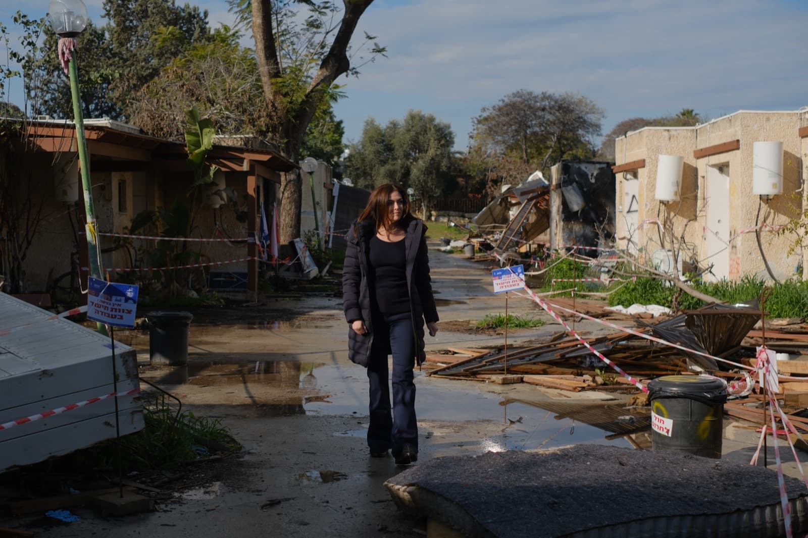 Sheryl Sandberg among the damaged homes of Kibbutz Kfar Aza.
