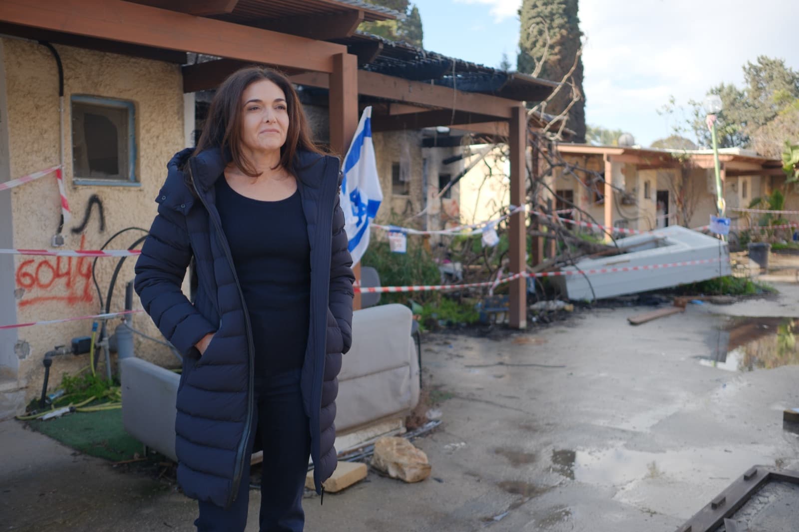 Sheryl Sandberg amid the destruction at Kibbutz Kfar Aza, one of the communities attacked on October 7.