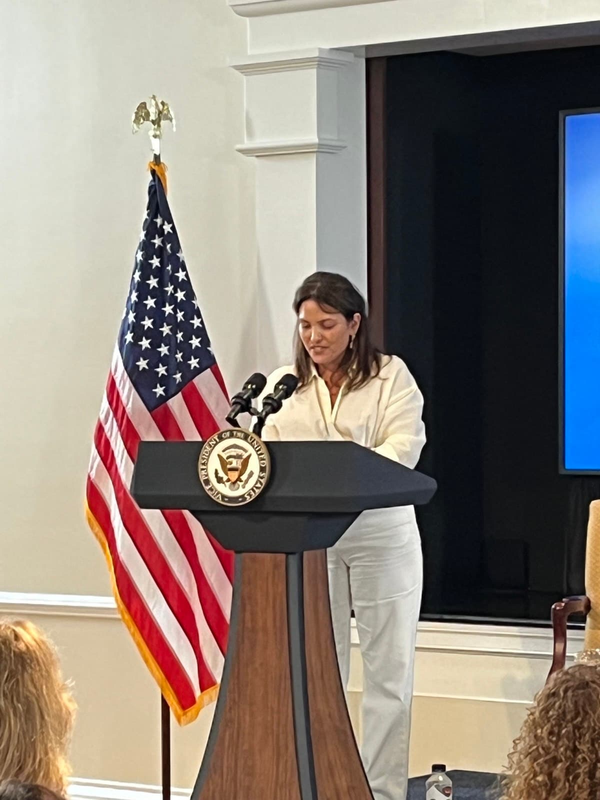 Former hostage Amit Soussana speaking at a podium with the seal of the Vice President of the United States, at the White House.